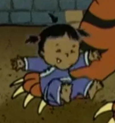 Niño amenazado por el tigre
